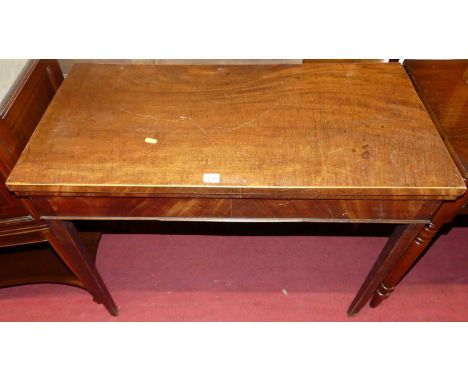 An early 19th century mahogany fold-over tea table, having rear gate leg action, width 91cm
