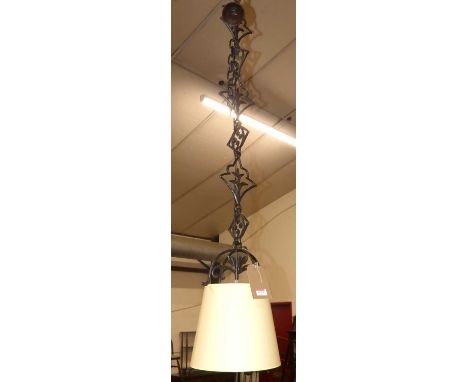 A contemporary black wrought metal floral decorated sectional hanging ceiling light, approx drop 150cm 