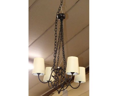 A contemporary wrought metal four branch hanging ceiling light, with ceiling rose and suspended on chains, approx drop 100cm