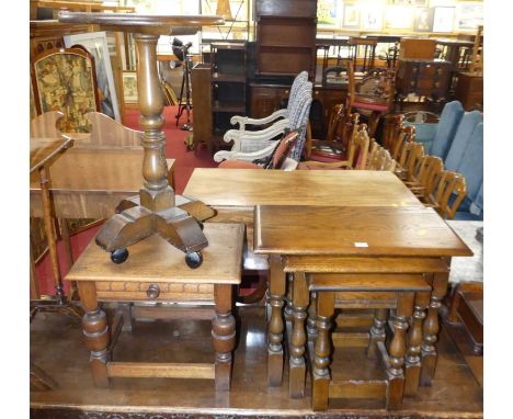 A contemporary Old Charm joined elm nest of three occasional tables, the largest width 60cm, together with a matching circula