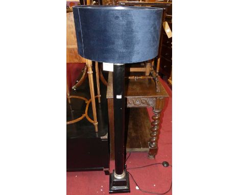 A contemporary black painted and silvered metal standard lamp with shade, height (excluding fittings) 123cm
