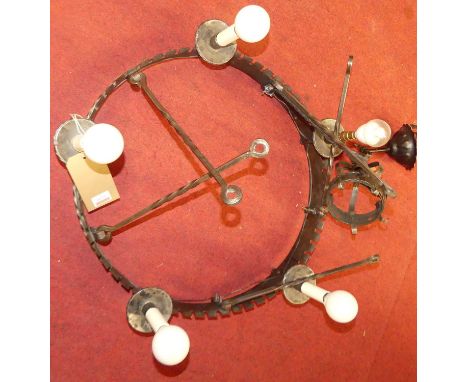 A wrought iron five-light ceiling pendant, with pleated red silk shades, wired for electricity 