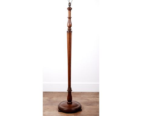 Attributed to Heals Oak, standard lamp, with tapering column on a circular base, standing on bun feet, numbered 'F78' to the 