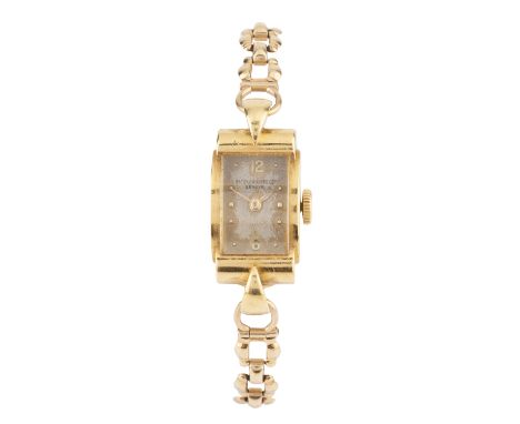 Lady's watch head by Patek Phillipethe rectangular silvered dial with Arabic numerals and bead markers, in shaped stepped cas