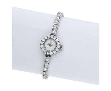 Rolex. A lady’s platinum and diamond-set bracelet watch, circa 1950. Movement: manual winding, 17 jewels. Dial: silvered, Ara