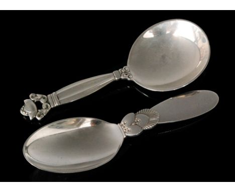 A Danish Sterling silver caddy spoon in the Cactus pattern, 1915 - 1930 Jensen marks,  Sterling, Denmark, and another in the 