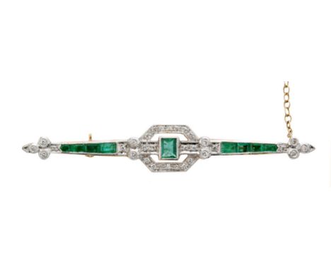 An 18ct hallmarked emerald and diamond set bar brooch, central collar set emerald within pierced pave set diamond head flanke