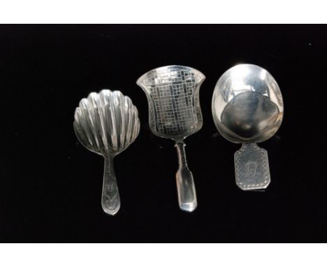 A George III hallmarked silver caddy spoon with shaped oval bowl and rectangular bright cut handle, London 1804, Elizabeth Mo
