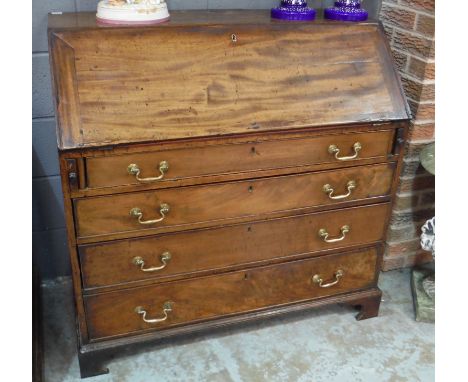 A Georgian mahogany fall front bureau, the fitted interior above four graduated long drawers and bracket feet, some damage an