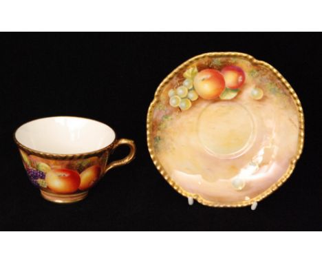 A Royal Worcester Fallen Fruits cabinet teacup and saucer decorated by Leaman with hand painted apples and blackberries to th