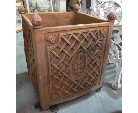 A pair of square terracotta planters each with a pineapple corner finial and lattice panel sides, height 53cm (2)