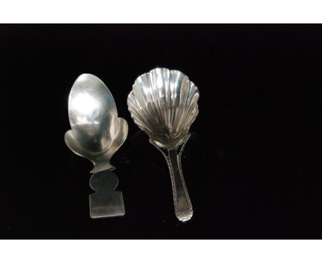 A George III hallmarked silver 'Acorn' caddy spoon, London 1808 and a shell bowl example with feather edge and cast flower an