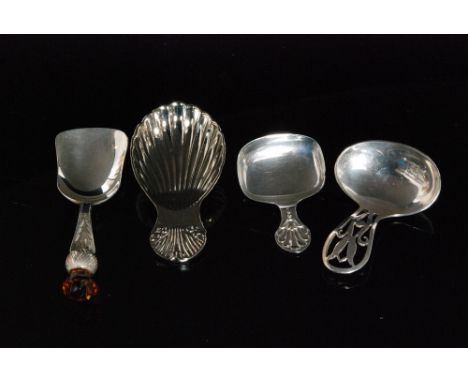 A hallmarked silver caddy spoon with thistle terminal, Birmingham 1931, J Cooper and Sons, and two other examples, Sheffield 