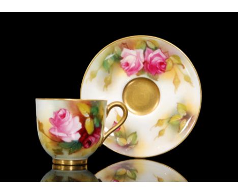 A matched Royal Worcester cabinet cup and saucer, the cup decorated by Spilsbury and the saucer by M. Hunt, both with hand pa