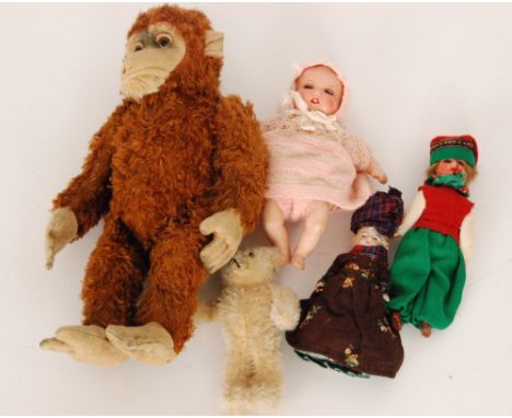 An early 20th Century Armand Marseille baby doll with soft body and composition limbs, height 19cm, two German bisque head co