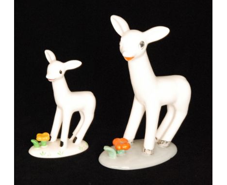 Two 1950s W R Midwinter Ltd Larry the Lamb figures, both to oval bases with a single coloured flower, the tallest marked, hei