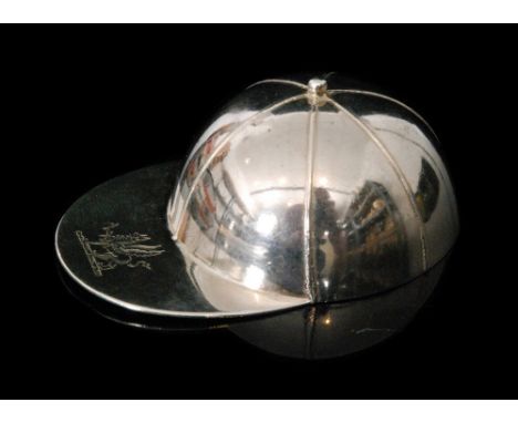 A Victorian hallmarked silver jockey's cap caddy spoon of plain form with gilded bowl, the peak with engraved armorial, the u