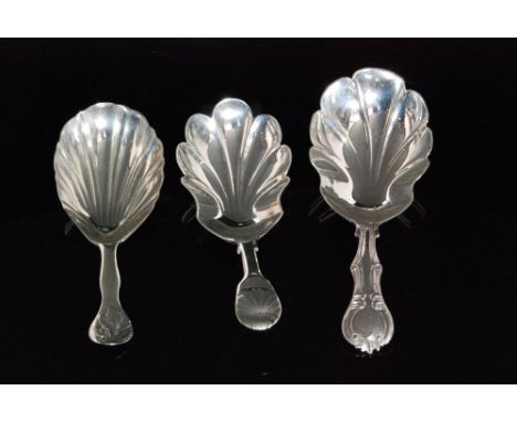 Three provincial silver caddy spoons to include a shell and fiddle pattern example with fluted bowl, Bristol 1818 William Woo