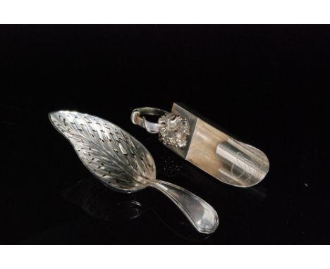 A modern Italian silver scoop shaped caddy spoon with scrolling loop handle and cast grapevine decoration, stamped marks for 