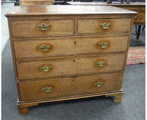 A Georgian oak and mahogany crossbanded chest of two short over three long drawers, raised to bracket feet, height 94cm and w