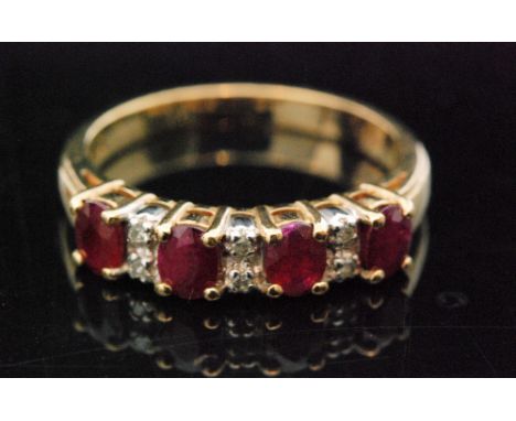 An 9ct ruby and diamond half eternity ring, four oval cut rubies spaced by pairs of brilliant cut diamonds to a plain band, r