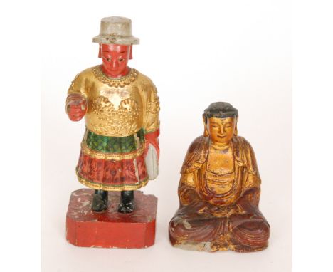 A painted carved wooden and composition figure of a seated Buddha, with bracket mount to the rear, height 15cm, together with