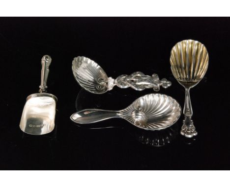 A Victorian hallmarked silver caddy spoon with fluted shell bowl below entwined terminal, Birmingham 1848,  another with shov