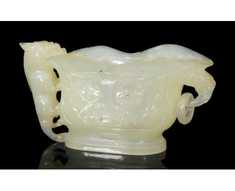 A Chinese carved hardstone twin handled libation cup, with dog of fo and ring loop suspension handles, height 7cm and width 1