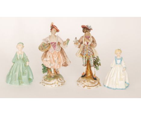 Two variant colourway Royal Worcester figurines 'Grandmother's Dress', one in green, the other in cream with blue highlights,