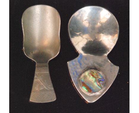 A 1930s hallmarked silver Hackney Rotary club caddy spoon London 1930, two white metal 'Festival of Britain' caddy spoons, a 