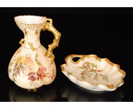 A late 19th Century Royal Worcester shape 1507 blush ivory jug decorated with a spray of flowers, the handle formed and spout