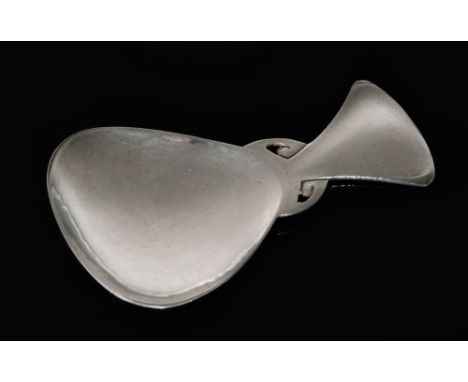 An Arts and Crafts Liberty and Co hallmarked silver caddy spoon, the shaped triangular planished bowl below fan shaped handle