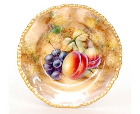 A Royal Worcester Fallen Fruits side plate decorated by Smith with hand painted peaches and black grapes, signed, black print