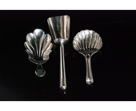 A George III hallmarked silver caddy spoon with elongated fluted bowl, Exeter 1819, William Woodman, another scallop shell bo