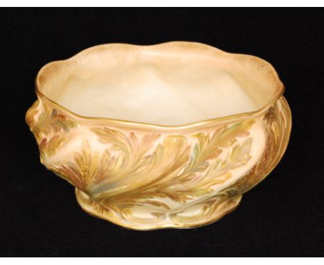 A late 19th Century Grainger & Co, Worcester footed bowl decorated with moulded wrythen leaves in shot enamels over a blush g