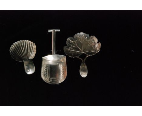A George III hallmarked silver caddy spoon, the textured and veined strawberry leaf below shaped handle, Birmingham 1808, Mat