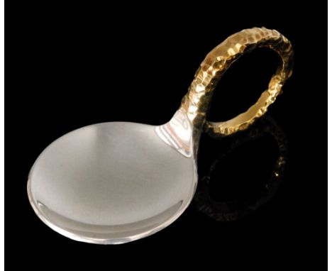 A modern hallmarked silver caddy spoon with circular silver bowl and parcel gilt flat hammered loop handle, London 1975, Stua
