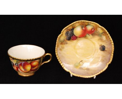 A matched Royal Worcester Fallen Fruits cabinet teacup and saucer, the teacup with hand painted peaches and cherries by G. Bo