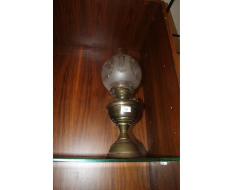 A PARRAFIN LAMP WITH FLUTE AND SHADE
