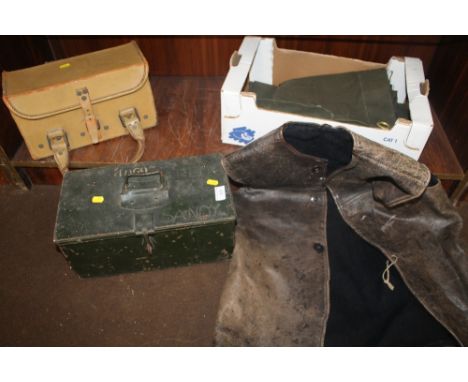 A METAL TRUNK TOGETHER WITH A LEATHER CARRY CASE LEATHER JACKET ETC