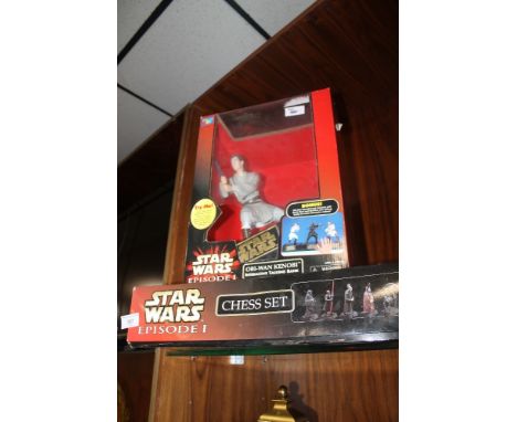 A BOXED STAR WARS EPISODE 1 TALKING BANK FIGURE OF OBI-WAN KENOBI, together with a boxed Star Wars Episode 1 Chess set 
