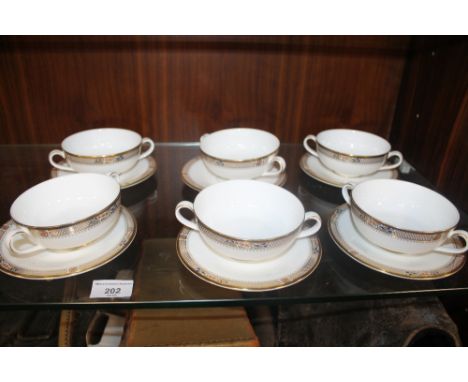 A SELECTION OF DECORATIVE MINTON CUPS AND SAUCERS