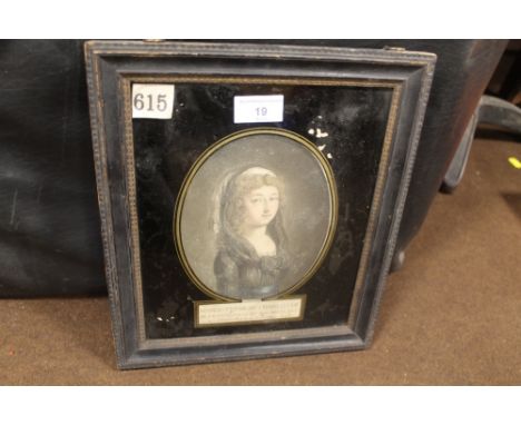 A FRAMED AND GLAZED COLOURED OVAL PORTRAIT OF A GIRL