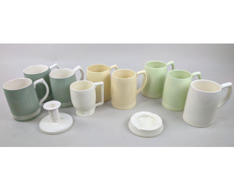 Wedgwood designed by Keith Murray; a candlestick, an ashtray, and nine mugs, in white, yellow and green, each with printed fa