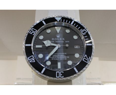 A modern aluminium wall clock in the form of a Rolex Oyster Perpetual Date Submariner