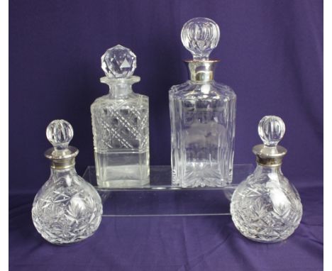 A pair of modern silver mounted cut glass decanters, maker Harrison Brothers &amp; Howson Ltd., Birmingham 1989, together wit