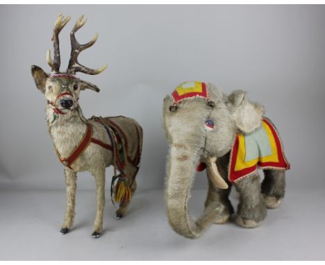 A Merrythought stuffed toy elephant 31cm high, together with a fur covered model of a reindeer