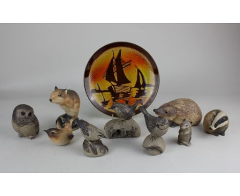 A collection of five Poole pottery models of garden birds, an owl and a mouse, tallest 9.5cm high, together with a Poole pott