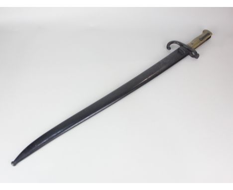 A 19th century French sword bayonet the blade engraved 'Culle Juin 1873' to the back edge, the steel crossguard stamped 75168