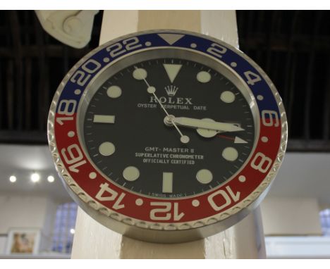 A modern aluminium wall clock in the form of a Rolex Oyster Perpetual Date GMT-Master II
